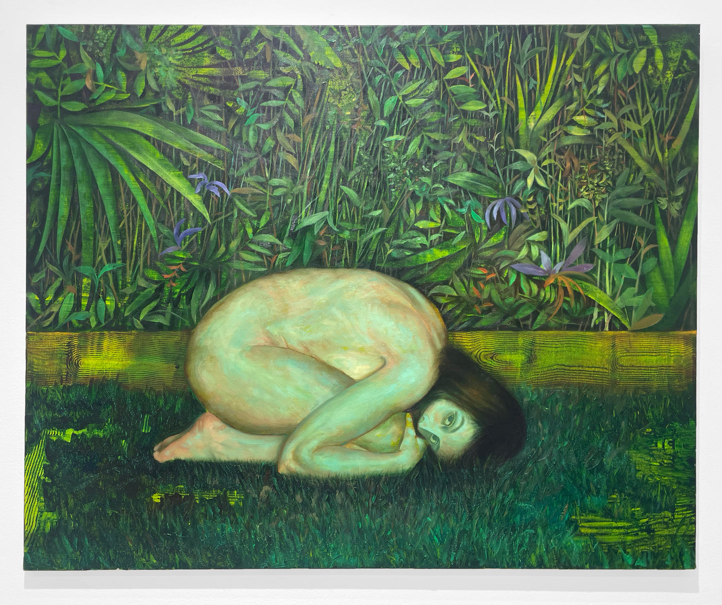 Among the whispers of ferns and petal